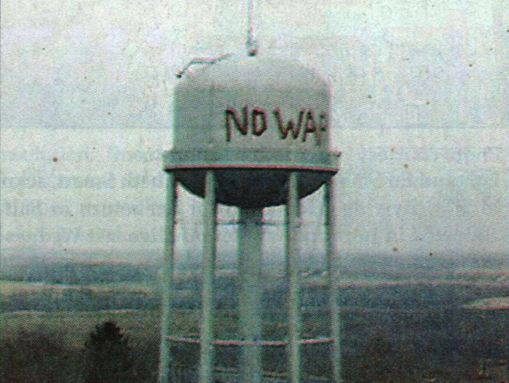 Water tower with the words 'No War' painted on it