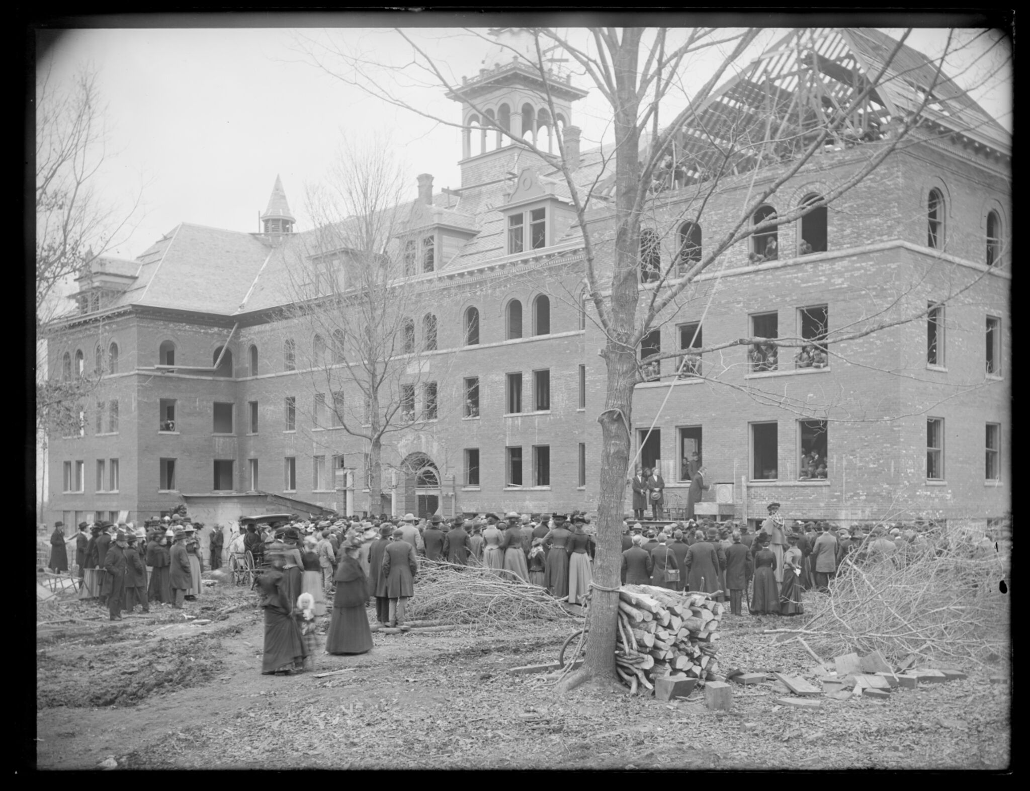 People gathered around Ytterboe Hall while it is still under construction