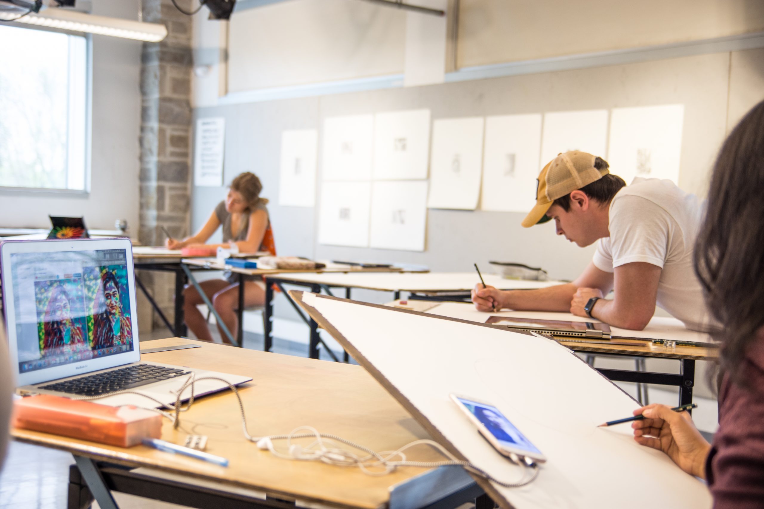 Art students sketching in a classroom