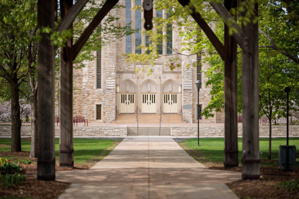 Doors to Boe Chapel framed by the wind chime archway
