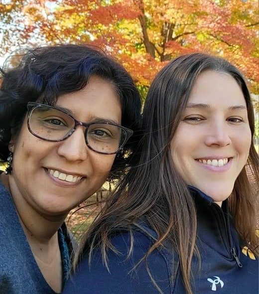 Claudia Gonzalez-George, left, with her staff colleague Liz Sandberg, an event and operations specialist in the Alumni and Parent Relations Office.
