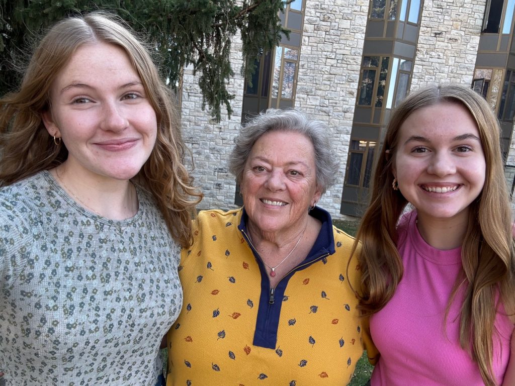 Elise Marlett '25, Cheryl Rose Jacobsen '69, and Anna Jacobsen '28 stand in front of Hoyme Hall, where each of them have lived during their time on the Hill.