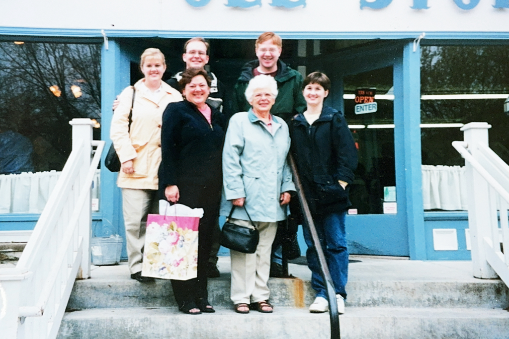 The family stands on the steps of the Ole Store Restaurant. Back row: Carey Jacobsen '96, Michael Marlett '94, and Brook Jacobsen '99. Front row: Cheryl Rose Jacobsen '69, Mary Evelyn Fogde Rose '46, and Jennifer Jacobsen '99.