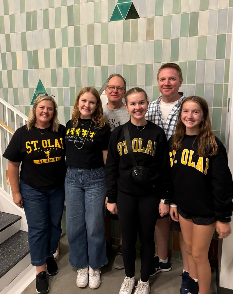 The family together in New Hall for Homecoming and Family Weekend 2024. Back row: Michael Marlett '94 and Brook Jacobsen '99. Front Row: Carey Jacobsen '96, Elise Marlett '25, Anna Jacobsen '28, and Emily Jacobsen.