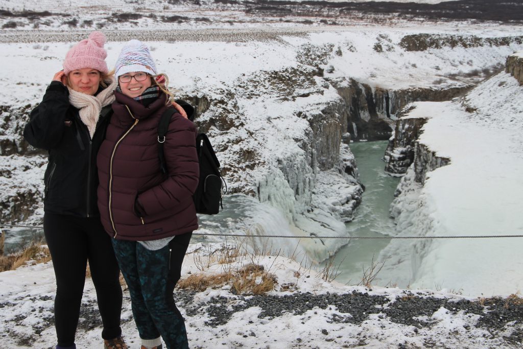 Sara Padula '11 in Gullfoss Falls, Iceland, in November 2018, meeting a fellow Ole halfway between the U.S. and UK while she was living in Bristol, England.