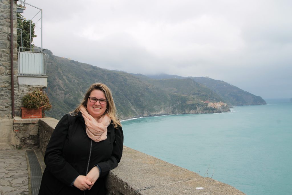 Sara Padula '11 in Cinque Terre, Italy, in March 2019 during a weekend trip with coworkers while living in Bristol, England.